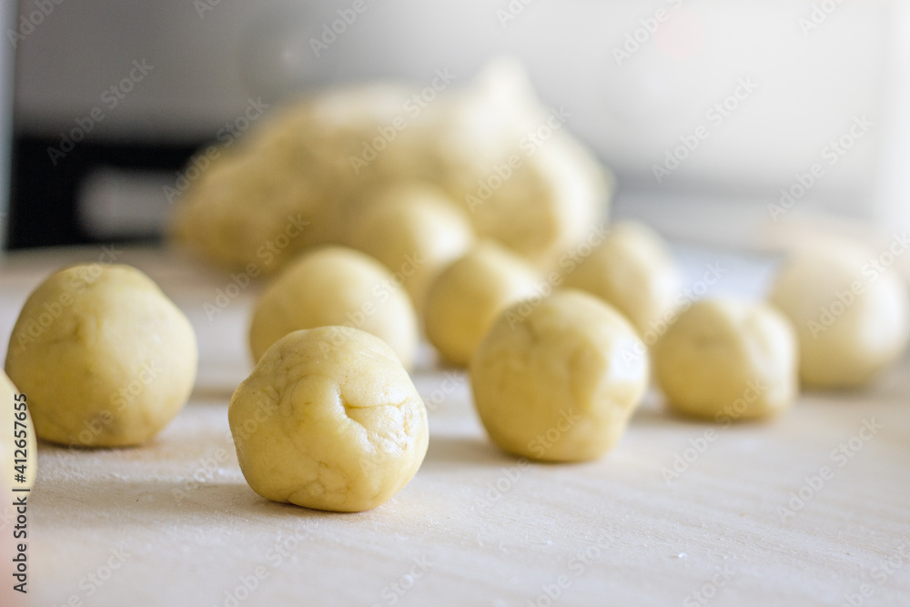 Close-up of homemade raw dough cookies on a baking sheet, authentic home baker hobby