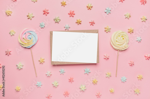 Gifts with note letter on isolated pink background with sweets, love and valentine concept