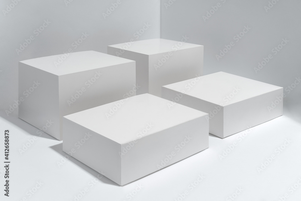 Empty Four white platform cubes on white background Empty Four white platform cubes on white background