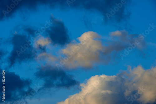 clouds and blue chase each other in the sky