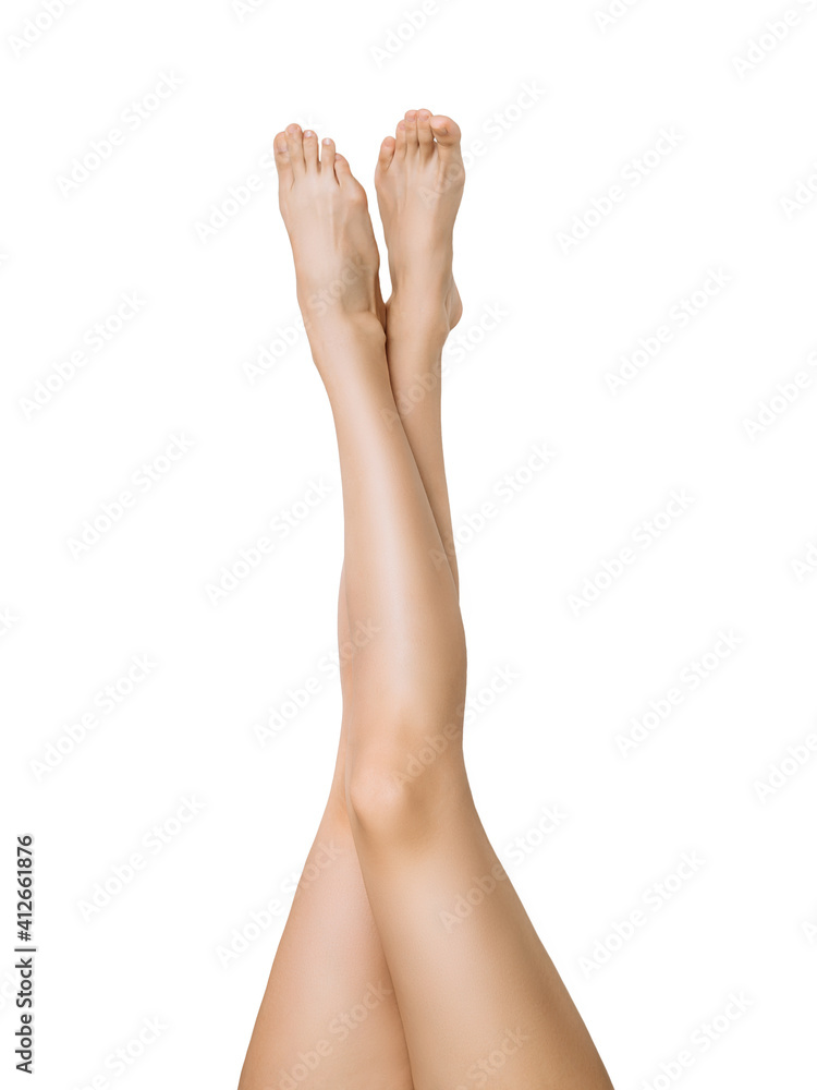 well-groomed slender legs of a young woman on a white isolated background. the concept of foot care, hair depilation, hair removal well-groomed slender legs of a young woman on a white isolated background. the concept of foot care, hair depilation, hair removal