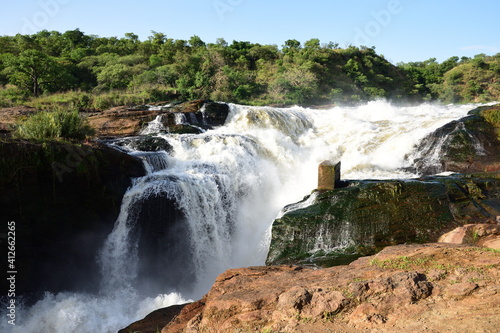 Murchison Falls National Park Uganda, white water, rocks, roaring water in beautiful green forest 