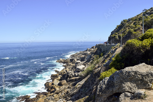 Small waves hitting the rocks in the slopes of the mountains in Cape Town, South Africa. © marisa