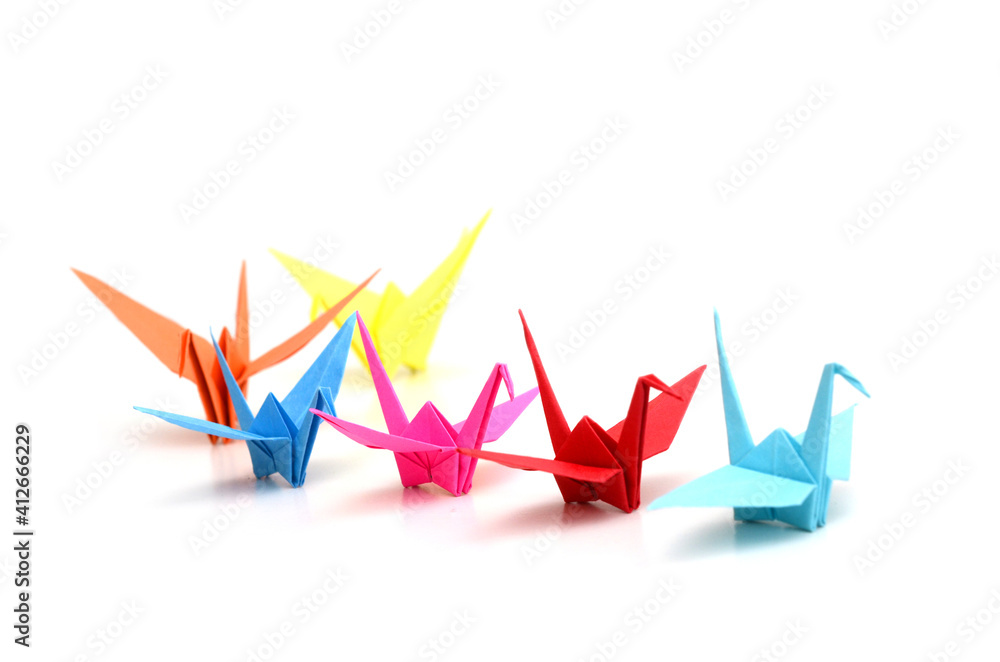 Origami paper cranes on follow in row Origami paper cranes on follow in row