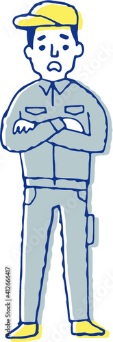 困っている表情の作業服姿の男性