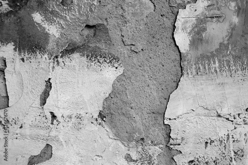 Grunge wall background. Old dry paint texture. Grungy wall abstract texture. Vintage material. Grunge crack wall surface.