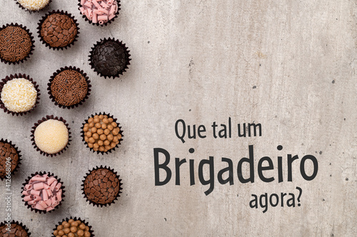 Typical brazilian brigadeiros, various flavors. Written "What about a brigadeiro now" in portuguese