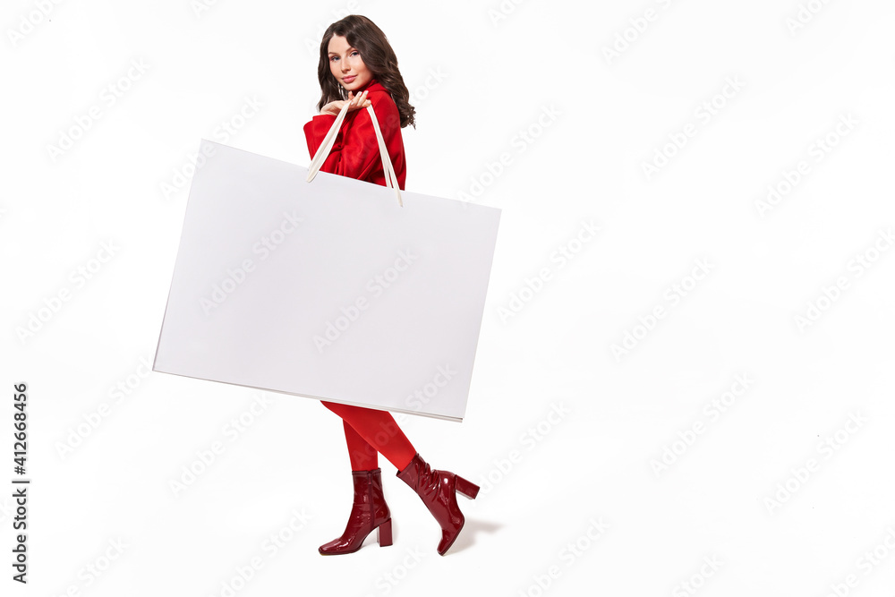Girl holding big white shopping bag with purchases Girl holding big white shopping bag with purchases