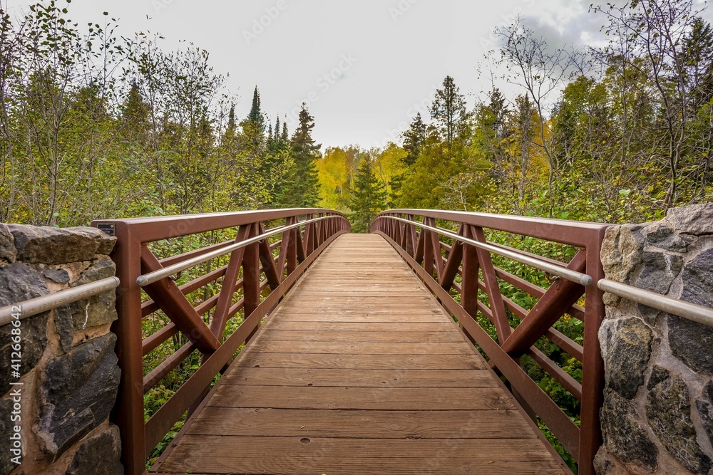 Wooden bridge over Gooseberry River at Gooseberry Falls State Park in northern Minnesota