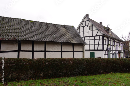 Closeup shot of two half-timbered buildings in Bergisch Gladbach, Germany photo