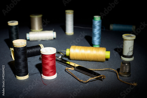 Red and other colored thread, buttons and sewing supplies 