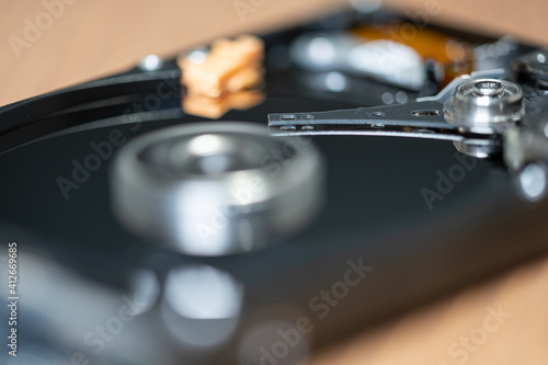 Close up photo of the read and write head of a hard drive while it is working 