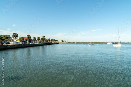 Boats on the Matanzas river and blue sky. San Agustin, Florida, United States.  photo