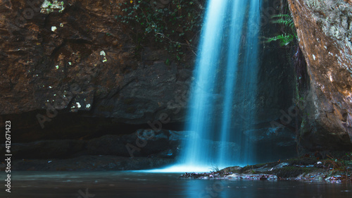 long exposure picture of a waterfall in the woods