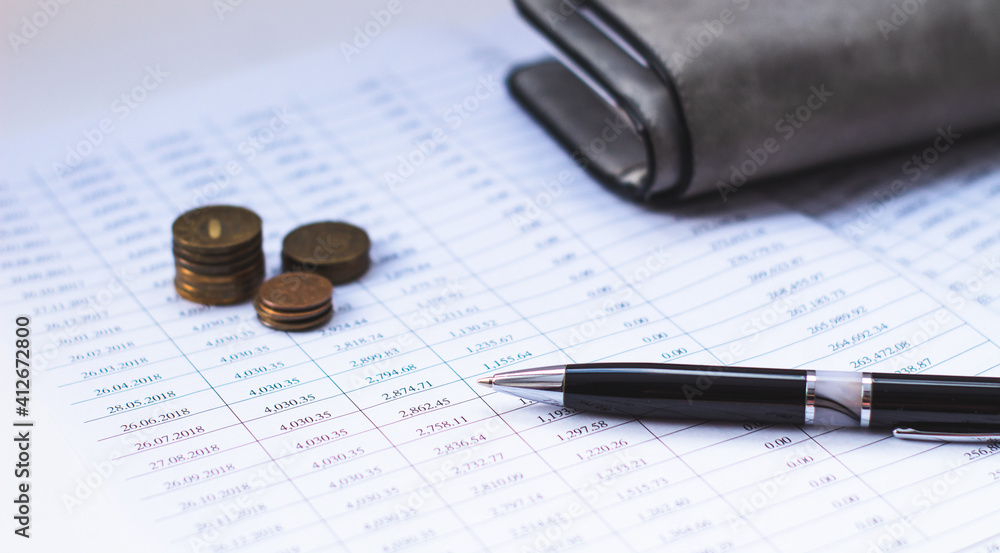 black pen on documents with graphs and calculations. Business concepts black pen on documents with graphs and calculations. Business concepts