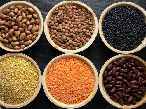 Obraz na plátně Dried, legume, leguminous plants, structure, assortment chickpea, kidney beans, pink coconut beans, green lenses, beluga lenses, millet, coral lenses, blond lenses, background