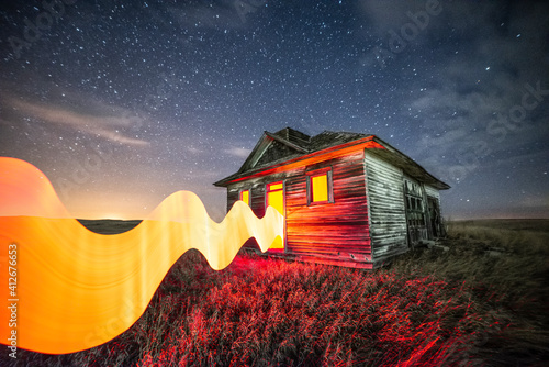 Long exposure, light painted abandoned building with starry sky