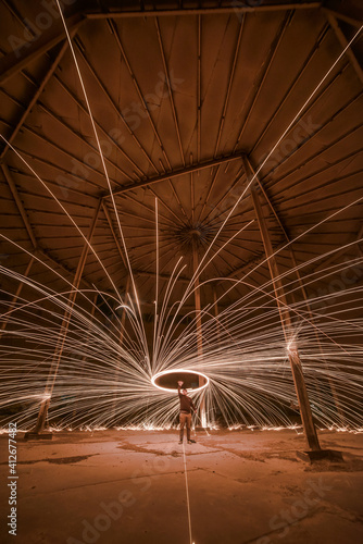 Long exposure, light painted steel wool spinning