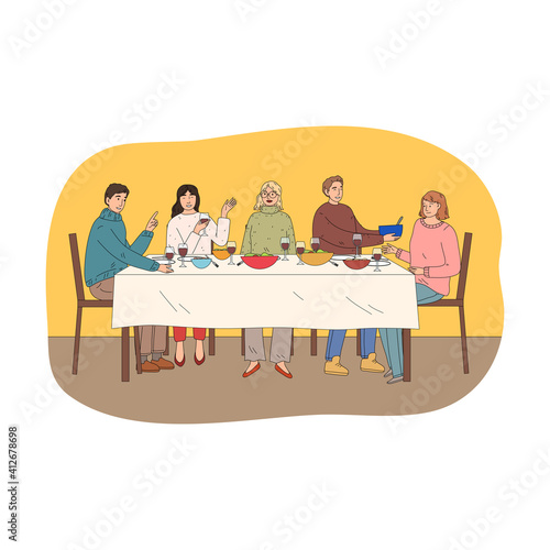 Happy young friends having holiday dinner celebrating holiday with dishes and wine