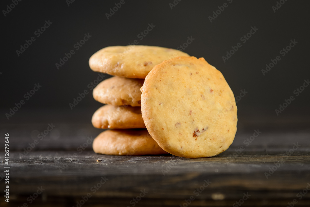 Fototapeta premium Pile of oat cookies on wooden table
