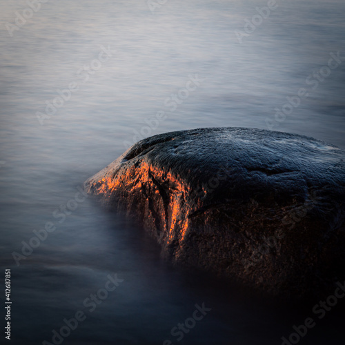 Canvastavla stones at sea at sunset and in the long exposition