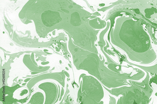 Green luxury marble ink texture on watercolor paper background. Marble stone image. Bath bomb effect. Psychedelic biomorphic art.