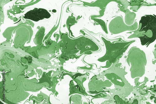 Green luxury marble ink texture on watercolor paper background. Marble stone image. Bath bomb effect. Psychedelic biomorphic art.