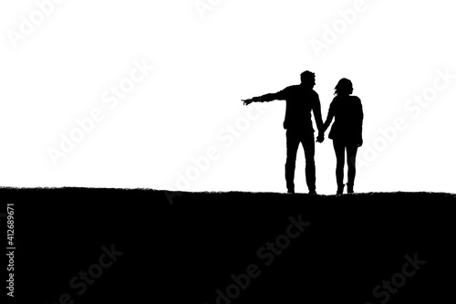 Silhouette of a lost man and woman trying to decide which way to go
