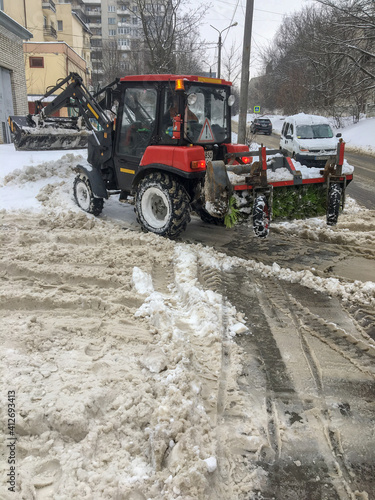 Lviv city, Ukraine, February 2021. Snowblower removes snow. Ukraine is covered with snow.