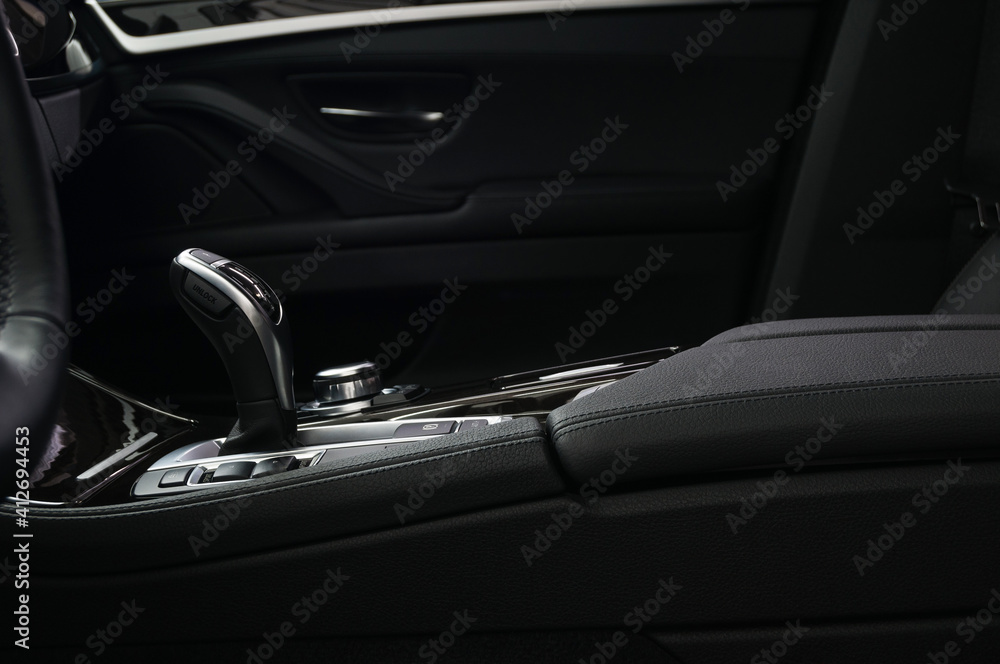 Business modern car interior background. Automatic transmission in modern luxury car.