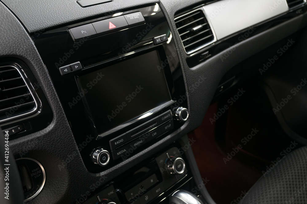 Multimedia screen in modern car. Interior detail.