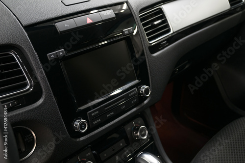 Multimedia screen in modern car. Interior detail.