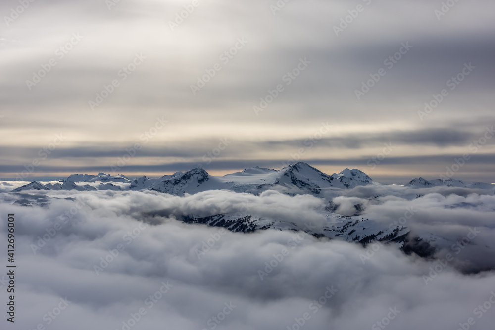 Whistler, British Columbia, Canada. Beautiful View of the Canadian Snow Covered Mountain Landscape during a cloudy and vibrant winter day.