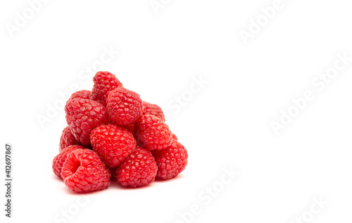 Bitter berry of ripe red raspberries on a white background