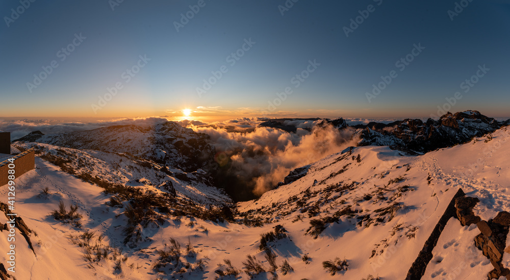 sunset in the mountains with snow