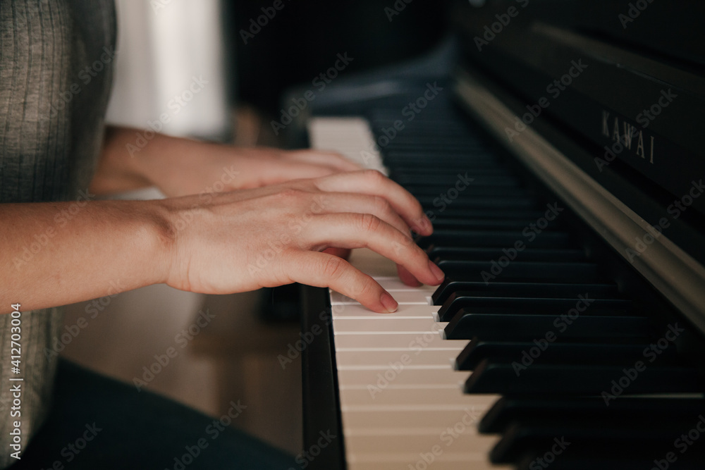 Playing piano Caucasian Person's hands playing on the piano. Hobbies concept.