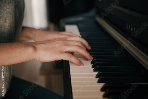 Playing piano Caucasian Person's hands playing on the piano. Hobbies concept.