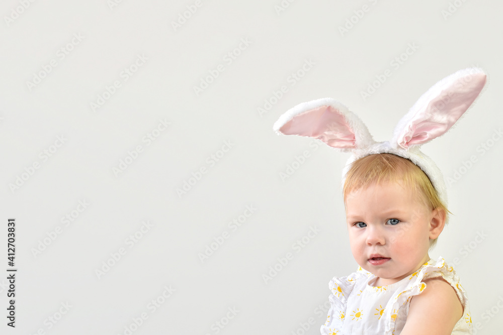 A little girl with bunny ears. Easter. Carnival. The Easter bunny. Banner with copy space A little girl with bunny ears. Easter. Carnival. The Easter bunny. Banner with copy space