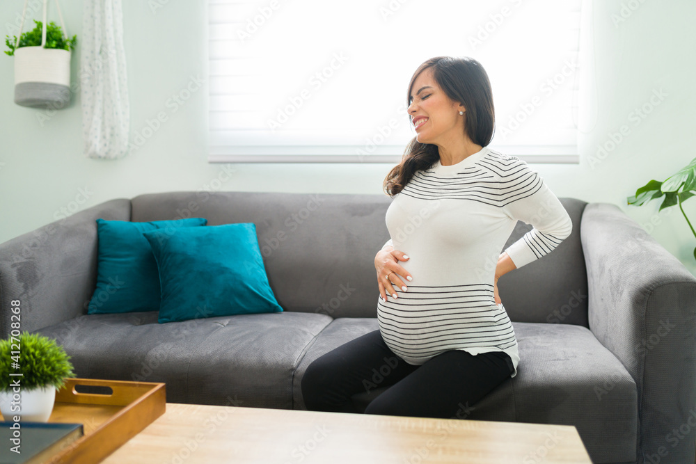 Pregnant wife having back pains because of her pregnancy