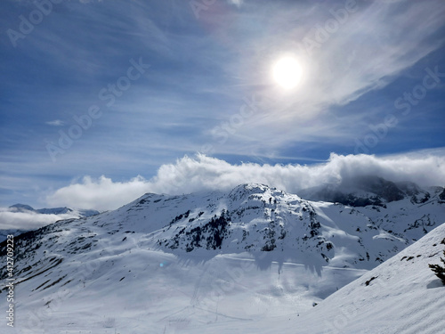 Snowy peaks and mountains in a sunny day © PEDROMERINO