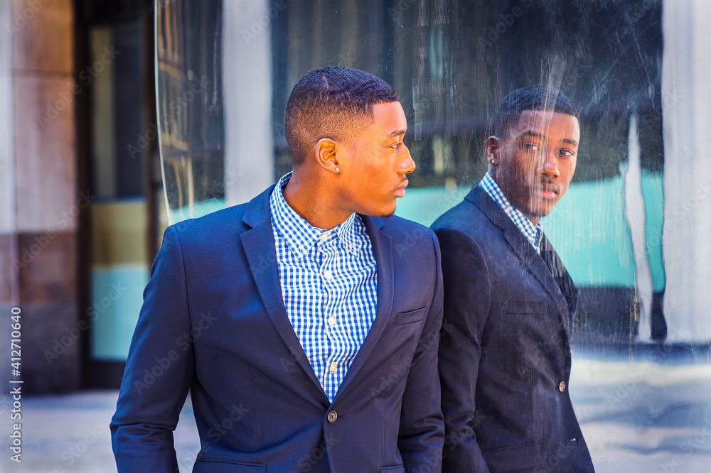 Young Man Looking at Mirror on Street.