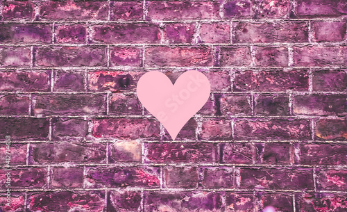 Valentine's day background with pink heart in the middle. Simple pink background vintage.