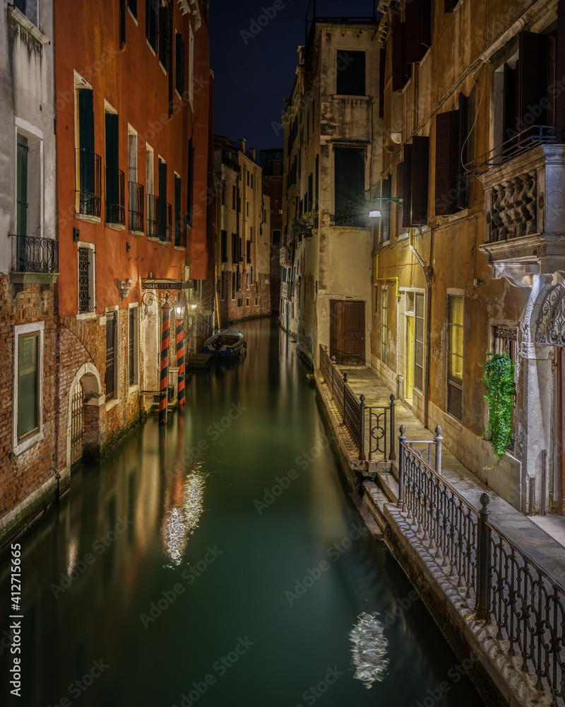 Scenic night view of a typical Venetian canal, Venice, Italy