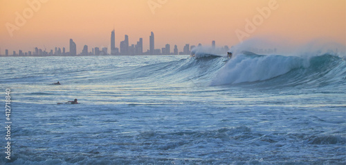 Surfer taking off at 