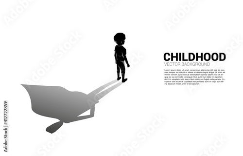 Silhouette of boy and his shadow of superhero.concept of potential in children.