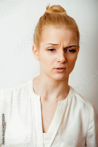 young blond woman on white backgroung gesture thumbs up  isolated emotional posing close up  lifestyle people concept
