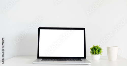 mockup laptop with isolated screen in the house in room
