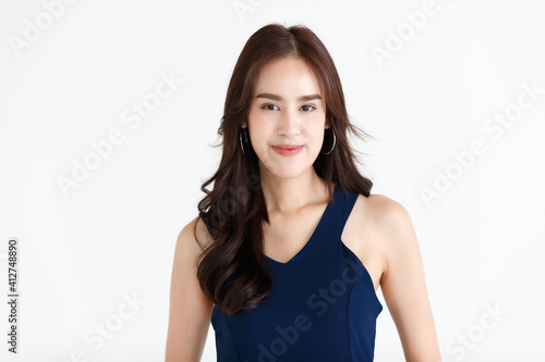 Portrait of a young teen Asian woman with black long hair on white background
