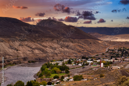 View of a small town, Ashcroft, by the Thompson River in the interior of British Columbia, Canada. Sunset Sky