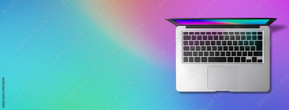 レインボーカラーの背景に 同じあしらいの壁紙 オリジナル を表示したノートパソコン Stock Photo Adobe Stock